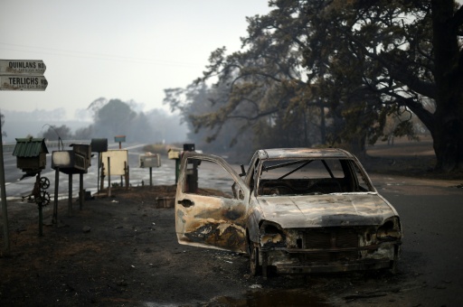 A burnt vehicle is seen on Quinlans street after an overnight bushfire in Quaama in Australia's New South Wales state on January 6, 2020 — SAEED KHAN / AFP