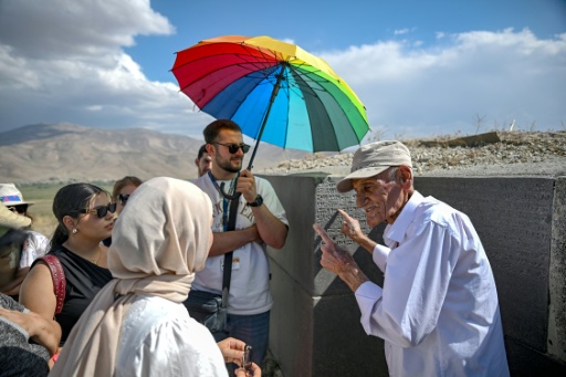 Mehmet Kusman guides tourists around the ancient Urartu fortress of Cavustepe near Van in eastern Turkey — Ozan KOSE / AFP