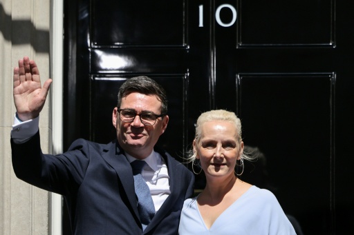 Britain's new Prime Minister Andy Burnham and his wife Marie-France van Heel pose on the steps of 10 Downing Street — Henry NICHOLLS / AFP
