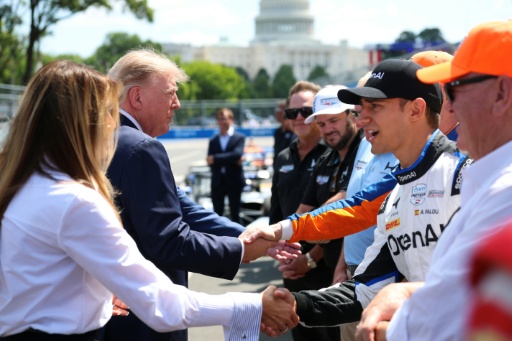 US President Donald Trump and First Lady Melania Trump, at left, greet IndyCar drivers before the start of the Freedom 250 Grand Prix on the streets of Washington — Kevin Dietsch
