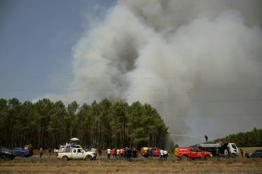 While spirits were high among the helpers, many expressed frustration at the state's response to a blaze — Ed JONES / AFP