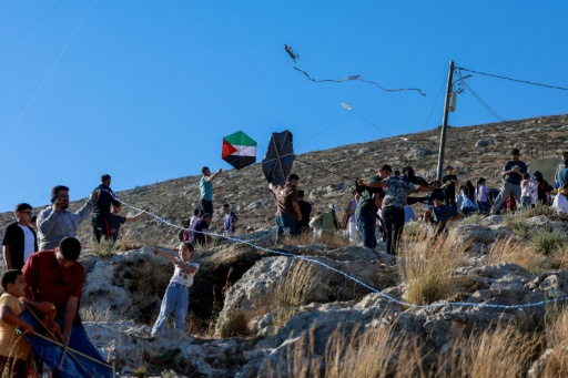 Palestinians from the Israeli-occupied WEst Bank village of Burin celebrate the annual kites festival, which they say offers some respite from the daily hardship
