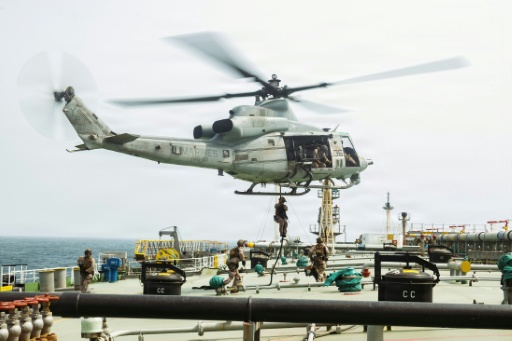 This US Marine Corps handout photograph taken on July 16, 2026, by US Central Command Public Affairs reportedly shows US Marines from the 11th Marine Expeditionary Unit conducting a verification boarding aboard M/T Wen Yao in the Gulf of Oman. — - / AFP