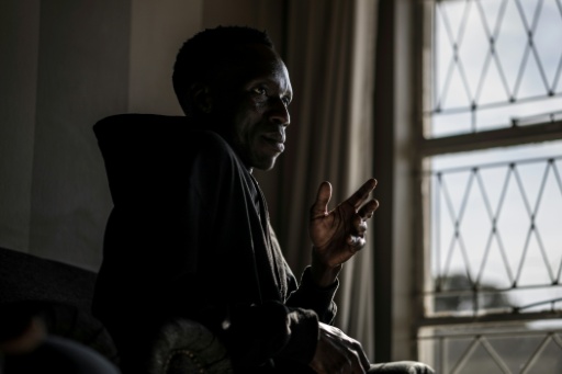 Zimbabwean national Benson Jere took refuge in a protected shelter — MARCO LONGARI / AFP
