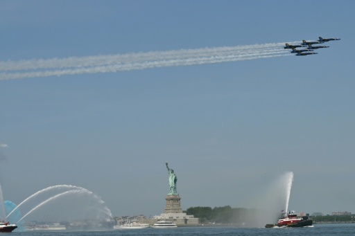 The US Navy's Blue Angels fly over the Statue of Liberty