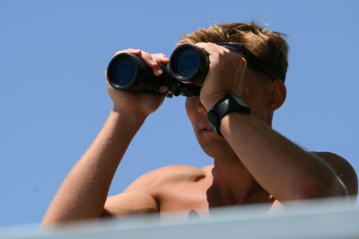 Lifeguard Maximus Oberto said the pace of rescues on some weekend days has been 'pretty hectic' — Patrick T. Fallon / AFP