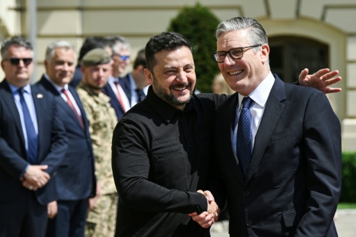 Keir Starmer, seen here with Ukraine's President Volodymyr Zelensky, has played a prominent international role but struggled with domestic unpopularity — Genya SAVILOV / AFP