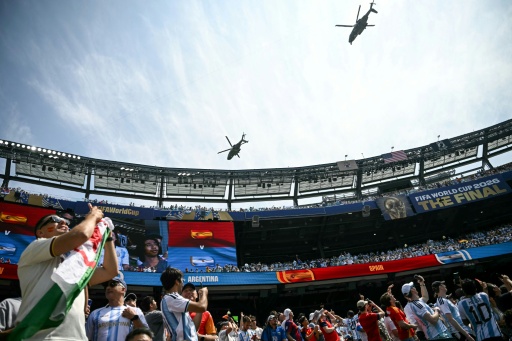 Trump lingers on stage to lap up World Cup spotlight
