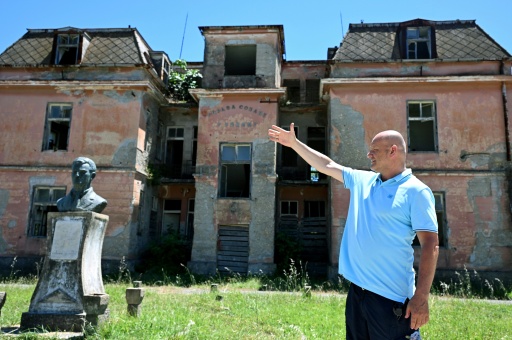 Journalist Mustafa Canka speaks during an interview with AFP in front of the management building of the abandoned saltworks in Ulcinj on June 14, 2026.
