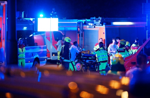 A woman died and dozens were hurt in the attack — RALF HIRSCHBERGER / AFP