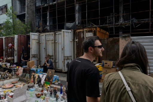 Kyiv's desperate vendors persevere outside obliterated flea market