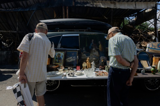 Vendors have little hold that the market will be rebuilt before the end of the war — Tetiana DZHAFAROVA / AFP