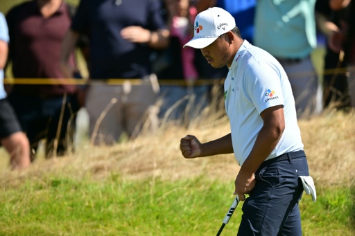South Korea's Kim Si-woo led the British Open with nine holes to play — ANDY BUCHANAN / AFP