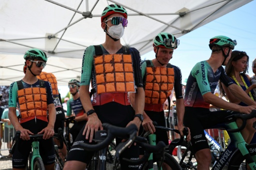 France's Paul Seixas and Decathlon CMA CGM teammates wear vests of ice-packs to cool down
