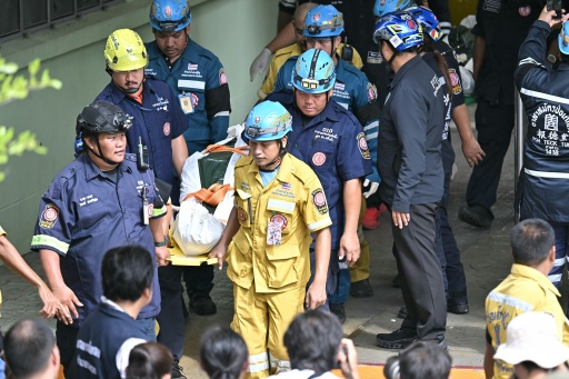 The bodies of school shooting victims are carried out of the school premises in Bang Kruai district, Nonthaburi province, north of the Thai capital Bangkok, on August 7, 2026. A teenager described as "troubled" by a classmate killed his grandparents before gunning down at least six more people at a school in Thailand on August 7, police said. — Lillian SUWANRUMPHA / AFP