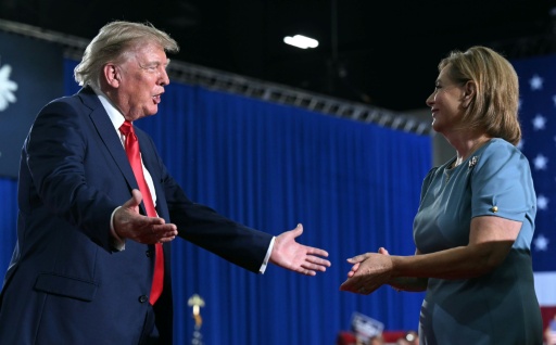 US Senator Darline Graham, pictured campaigning with President Donald Trump on August 21, 2026, has acknowledged that she is "not that informed on national security" — SAUL LOEB / AFP