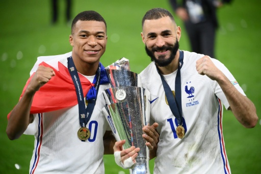 Kylian Mbappe and Karim Benzema with the trophy after scoring when France beat Spain in the 2021 UEFA Nations League final