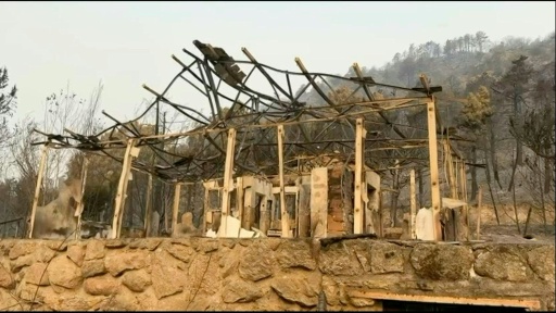 Wildfires leave burnt out cars and houses in Spain's Avila province — Jeremy AUDOUARD / AFP