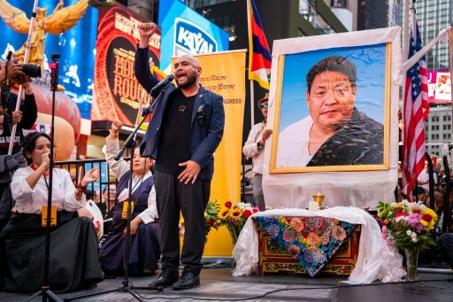 Lobga Rangzen, pictured on the right at a vigil after his death, had recorded a farewell message calling on Tibetans living in exile to take action for the region's independence — Angelina Katsanis / AFP