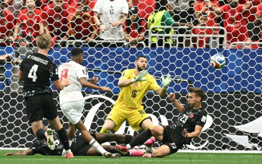 Azzedine Ounahi (white shirt) scores Morocco's second goal against Canada as the north Africans moved into the World Cup quarter-final