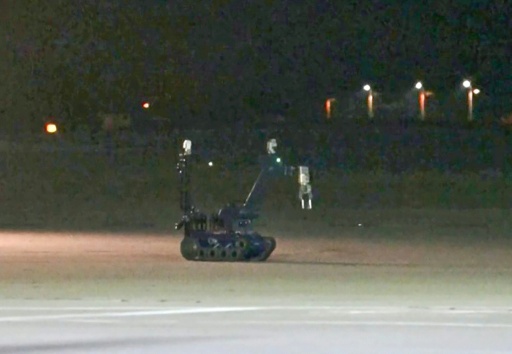 Video footage from News5 showed the police bomb-disposal robot — - / AFP