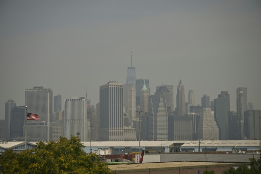 Wildfire smoke from Canada cast a haze over the lower Manhattan skyline — ANGELA WEISS / AFP