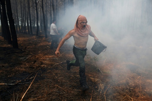 Volunteers and firefighters helped stabilise a massive fire near Bordeaux — ROMAIN PERROCHEAU / AFP