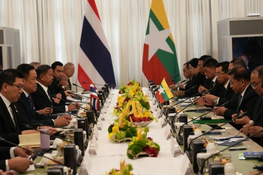 Thailand's Prime Minister Anutin Charnvirakul (2nd L) speaks during a bilateral meeting with Myanmar's President Min Aung Hlaing (2nd R) at Government House in Bangkok. — Sakchai Lalit / AFP