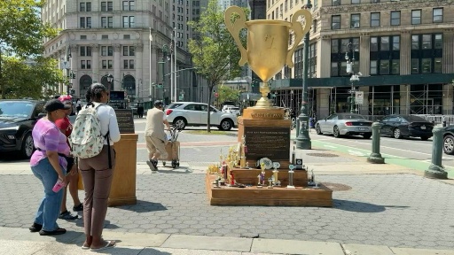 Satirical gold trophy mocking Trump appears in New York