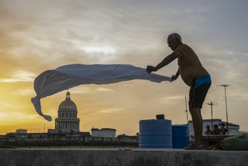 Cubans find rest on rooftops as blackouts drive them from home