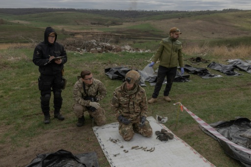 Yukov believed the souls of the dead would remain there, until the bodies got a dignified burial — Roman PILIPEY / AFP