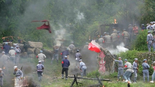 Explosions, red flags: Chinese tourists reenact communist victory