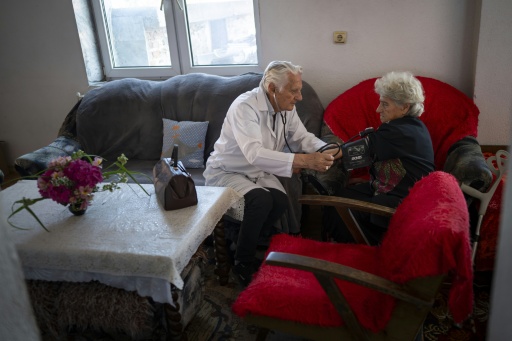 Patients come to doctor Kiril Apostolov seeking help with a range of issues including high blood pressure and diabetes — Nikolay DOYCHINOV / AFP