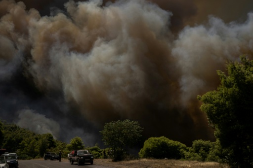 More than 400 firefighters were battling blazes in the area of Porto Germeno on the Gulf of Corinth — Angelos TZORTZINIS / AFP