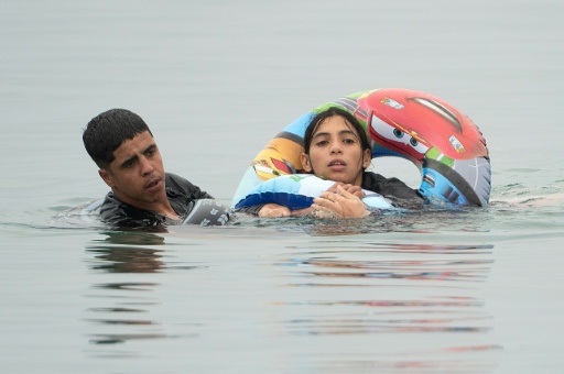 A local official said 60,000 migrants had entered Cueta. Spain's interior ministry said 25,000 of them had voluntarily returned to Morocco — JORGE GUERRERO / AFP