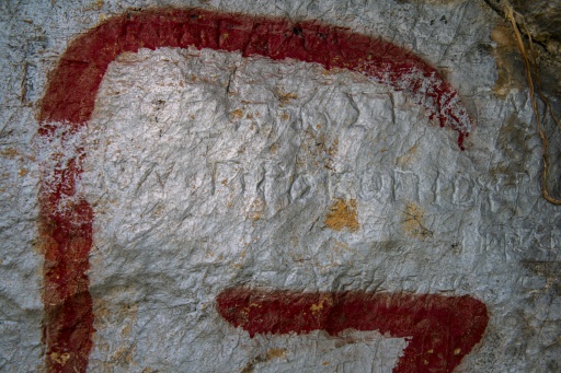 Greek writing can be seen carved into the wall of the cave -- but it is not clear how old it is — Ahmet Ayberk Cimen / AFP