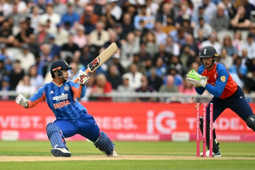 India's Vaibhav Sooryavanshi (L) is stumped by Jos Buttler (R) off the bowling of England's Will Jacks during the second T20 at Old Trafford