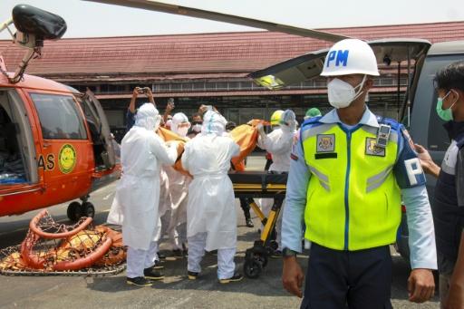 Bad weather hampers Indonesia ferry rescue, dozens still missing