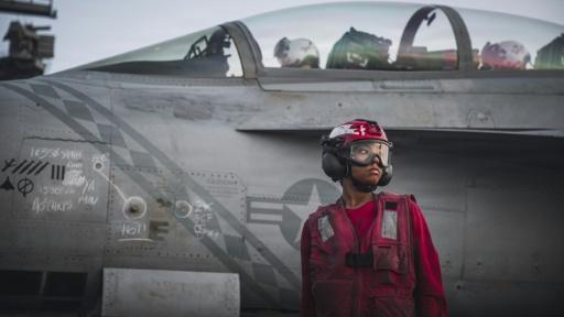 This handout picture released by the US Navy on September 13, 2026, shows a US Sailor after checking ordnance on an F/A-18 Super Hornet, attached to Strike Fighter Squadron (VFA) 102, on the flight deck of Nimitz-class aircraft carrier USS George Washington (CVN 73) on September 13, 2026. President Donald Trump has repeatedly brushed off concerns of depleted weapons stores during the six months of war in the Middle East, saying recently that the US has "virtually unlimited" ammunition. — - / AFP