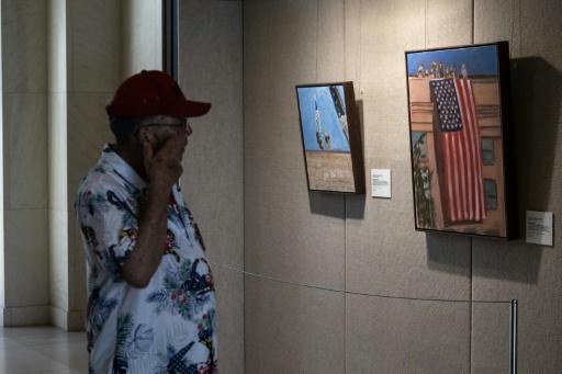 Several of former US president George W. Bush's 9/11-related art works feature images of the American flag, including one of the Stars and Stripes unfurled at the Pentagon after the 2001 attacks — RONALDO SCHEMIDT / AFP
