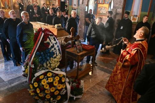 Mourners stands past the coffin of late Bosnian Serb military leader Ratko Mladic while taking part in a public memorial on the day of his funeral ceremony at St Lukas church in Belgrade, on September 7, 2026. — OLIVER BUNIC / AFP