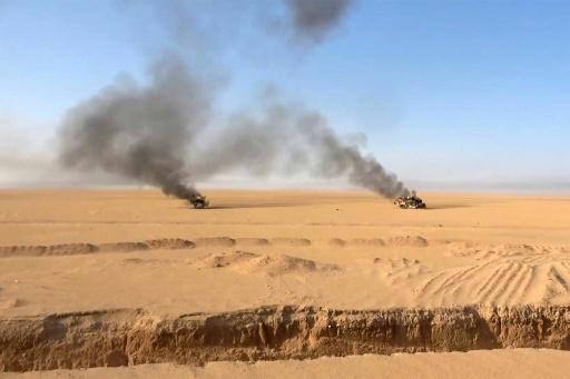 صورة وزعها الاعلام الحربي للحوثيين في 15 أيلول/سبتمبر قال إنها تظهر احتراق عربات عسكرية استهدفوها في محافظة الجوف اليمنية — -