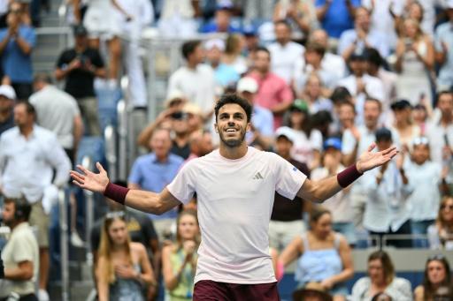 Argentina's Francisco Cerundolo reacts after defeating American Taylor Fritz to reach the US Open fourth round — ANGELA WEISS / AFP