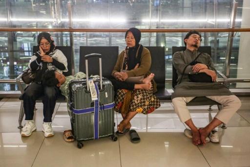 Eight airports in Indonesia  halted operations over the weekend after ash was detected in their airspace, disrupting thousands of flights — Syarief Akbar / AFP
