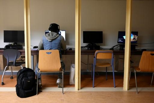 A student works on a computer in a room of the Aix-Marseille University in Marseille, southern France, on November 19, 2020, as the university opened rooms for students in need to take courses online, during the French national lockdown aimed at containing the spread of Covid-19 pandemic caused by the novel coronavirus. Only online classes are now available in the French universities, after the discover of several virus clusters since September. The Aix-Marseille University, which normally welcomes about 80