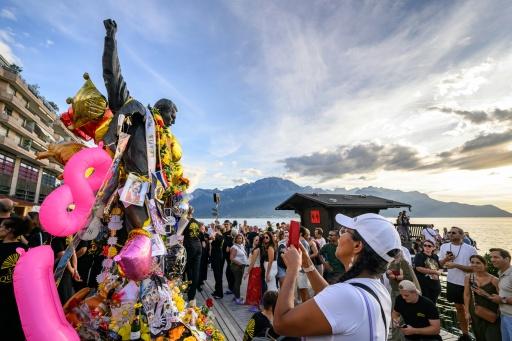Fans gathered around the Freddie Mercury statue overlooking Lake Geneva as they celebrated his 80th birthday — Fabrice COFFRINI / AFP