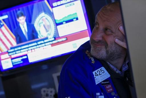 US stock markets, which had largely priced in Wednesday's rate hike, were down on the news, expected with any rate hike as equities become less attractive — TIMOTHY A. CLARY / AFP