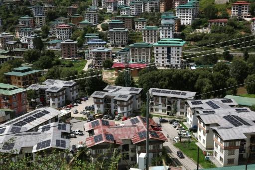 Solar panels on rooftops of buildings in Bhutan's capital city of Thimphu — Niharika KULKARNI / AFP