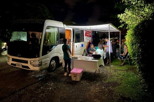 A Medical Services Pacific Moonlight programme team offering free HIV testing during an outreach visit to a suburb of Suva — STR / AFP